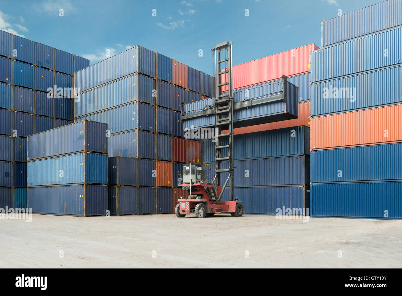 Crane lift up container box loading to cargo container depot use for logistics import export. Stock Photo