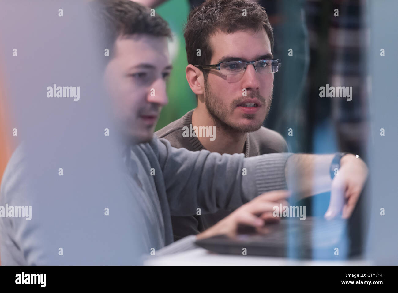 young computer technology students on code programming class have ...