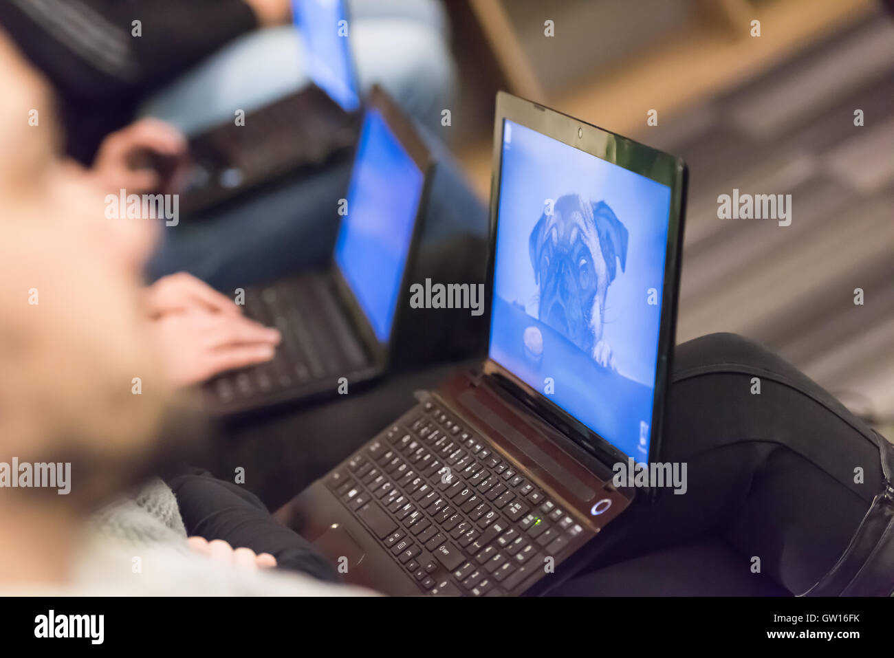 it students on listening presentation and taking notes on laptop computer Stock Photo