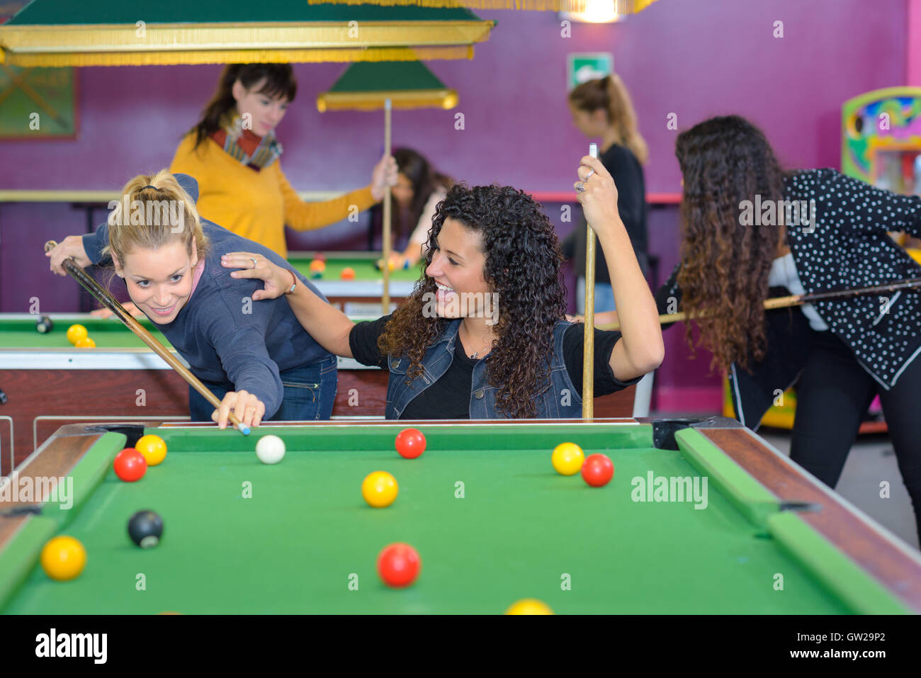 friends playing billiards Stock Photo Alamy