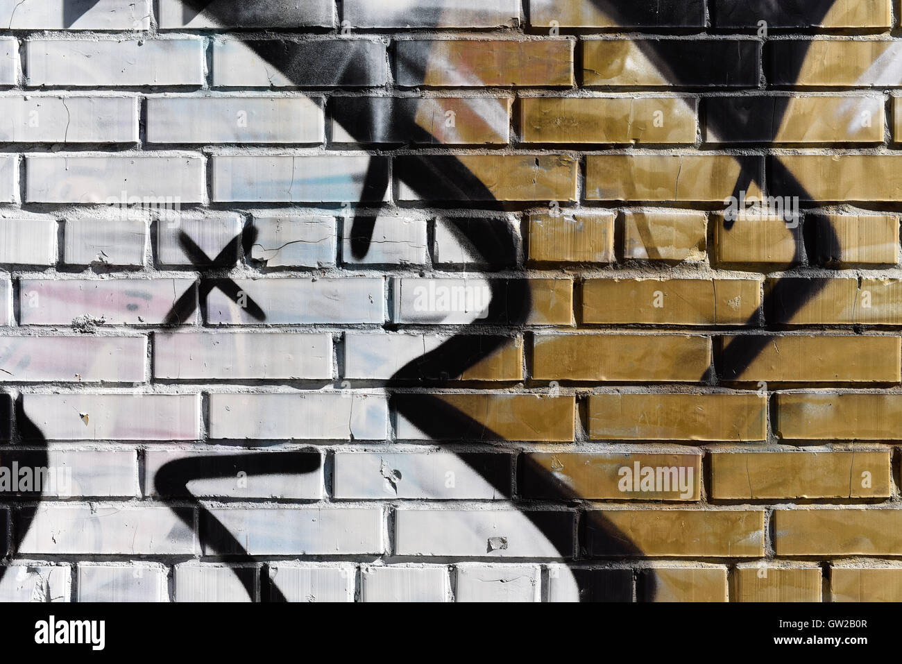 Detail of graffiti brick wall of an apartment house - Background ...