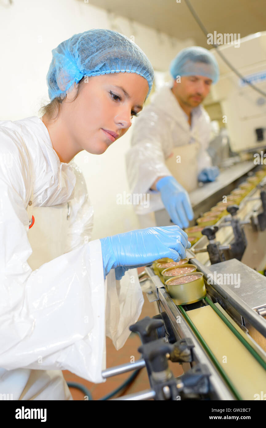 Factory workers on production line Stock Photo - Alamy