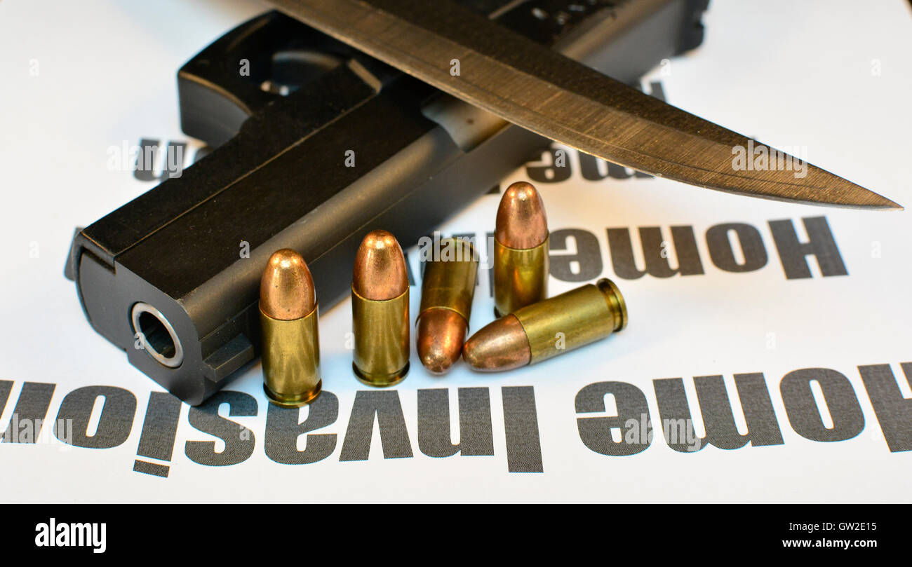 Crime Home Invasion Handgun with bullets and knife. Gun violent crime, assault. Shooting. Stock Photo