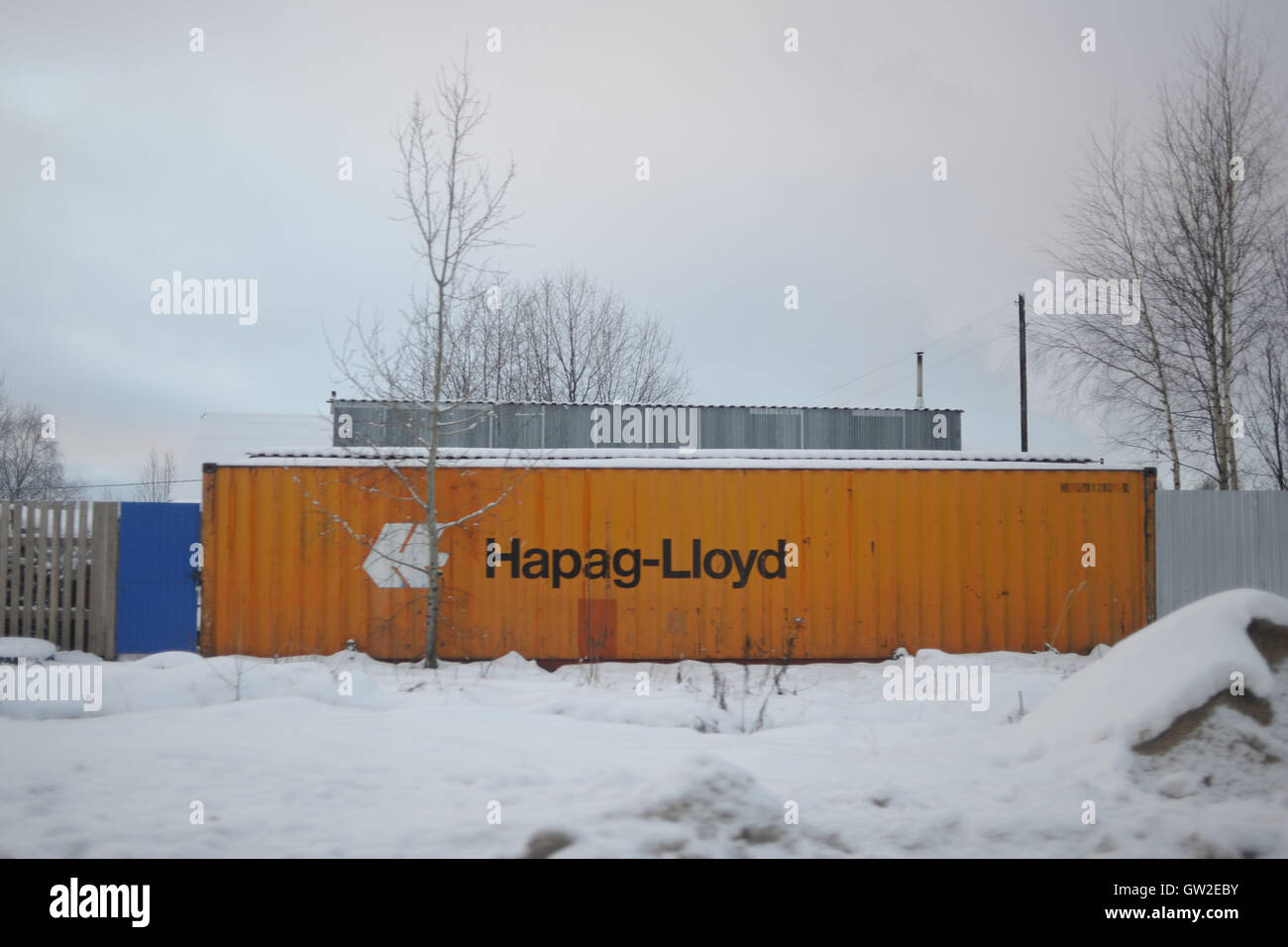 The container shipping company Hapag-Lloyd used as fence in Krasnozatonskiy, Komi Republic, Russia, Europe Stock Photo
