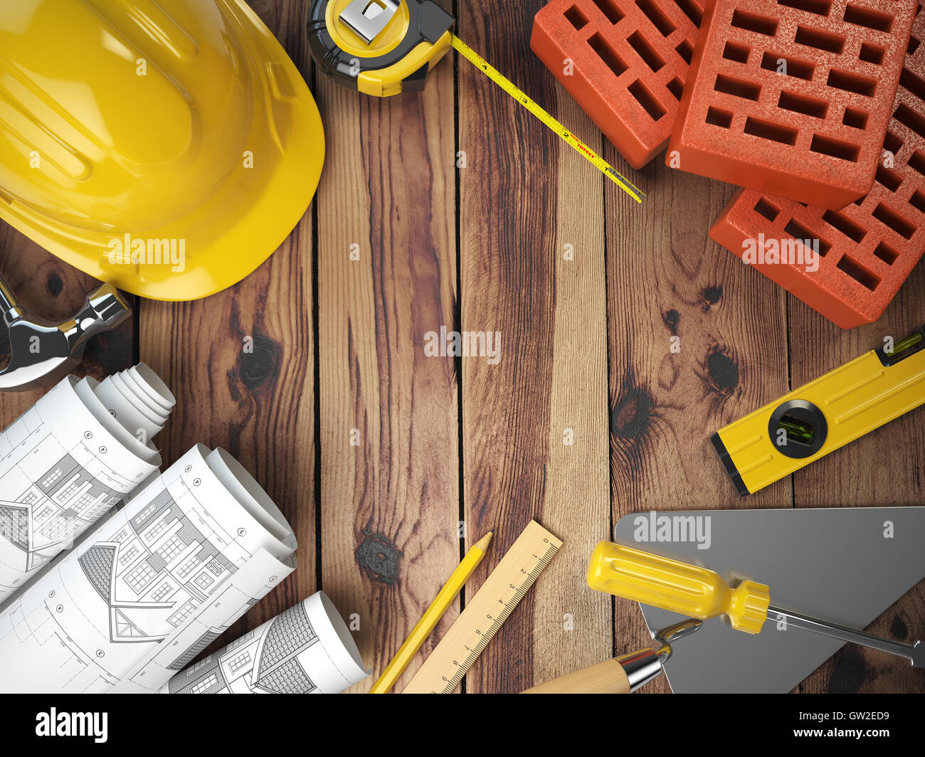 Construction tools on a wooden background. Hard helmet, bricks, trowel ...