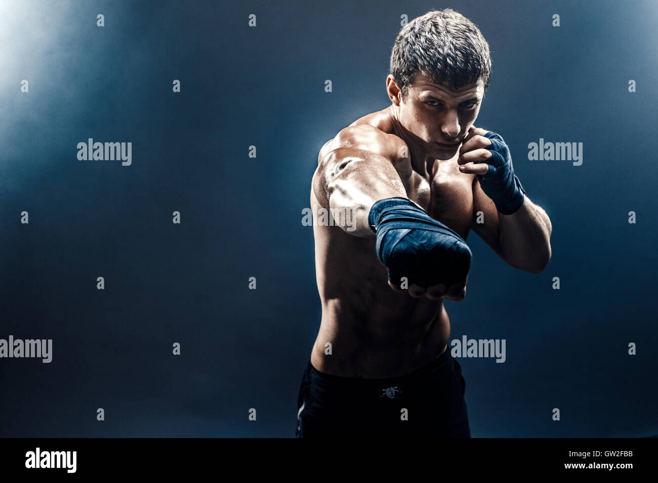 Sportsman Muay Thai Boxer Celebrating Flawless Victory in Boxing Cage.  Isolated on Black Background with Smoke. Copy Stock Image - Image of  people, handsome: 91121441