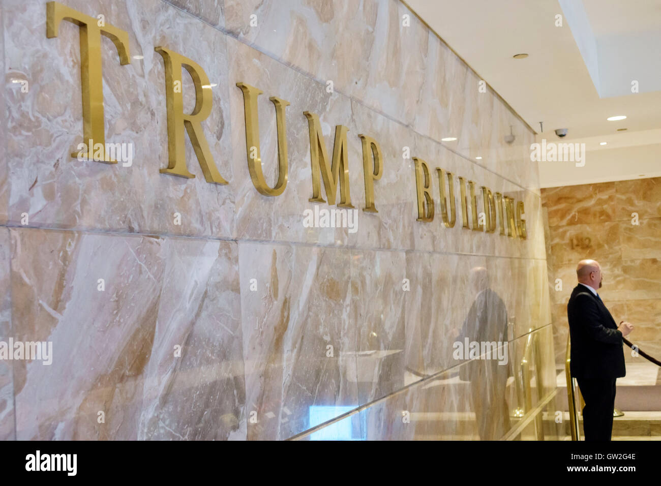 New York City,NY NYC Lower Manhattan,Financial District,Wall Street,Trump building,lobby,security guard,marble,sign,NY160716075 Stock Photo