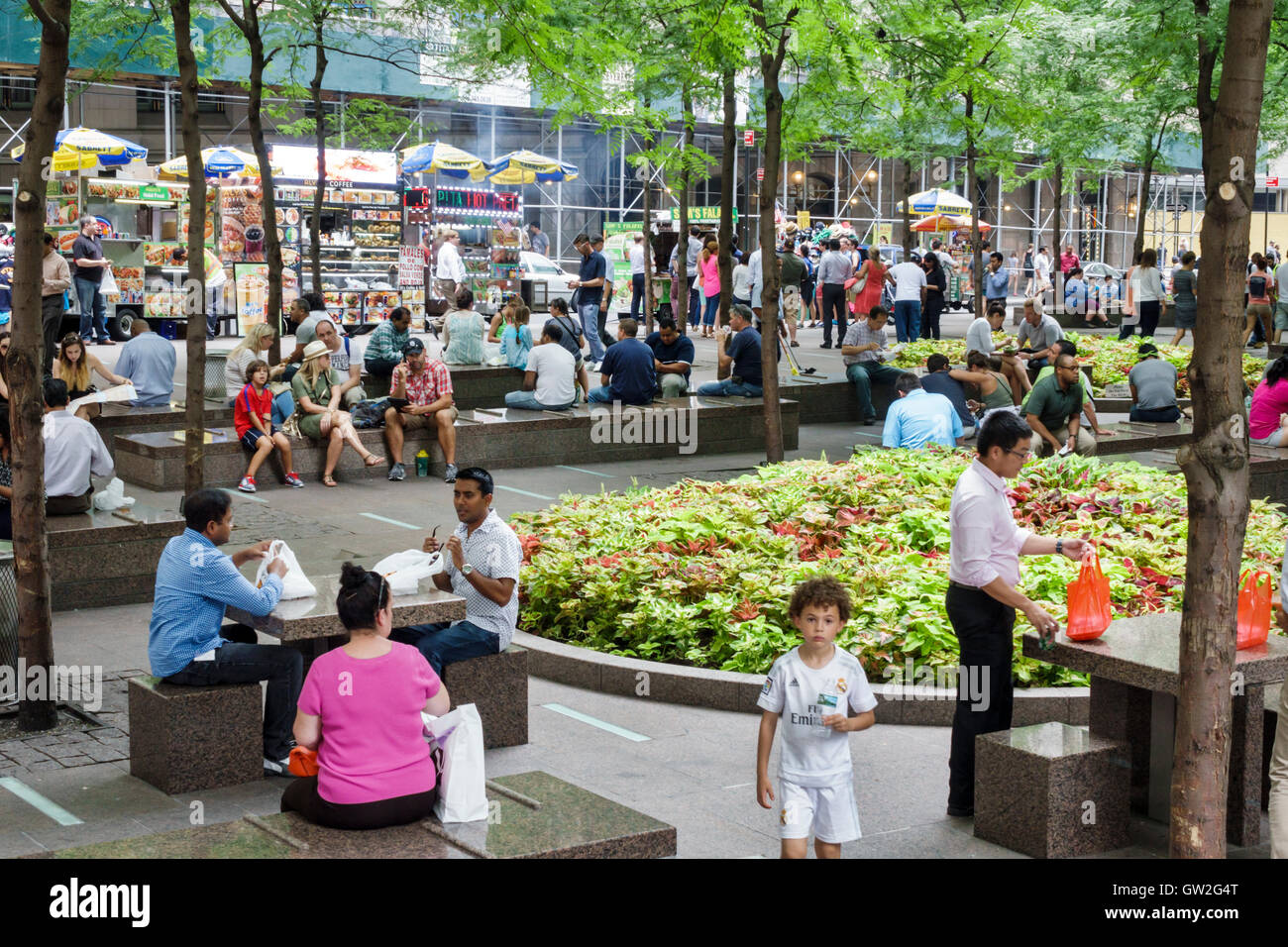 New York City,NY NYC,Lower Manhattan,Financial District,Zuccotti Park,Liberty Plaza Park,public park,crowded,Asian Asians ethnic immigrant immigrants Stock Photo