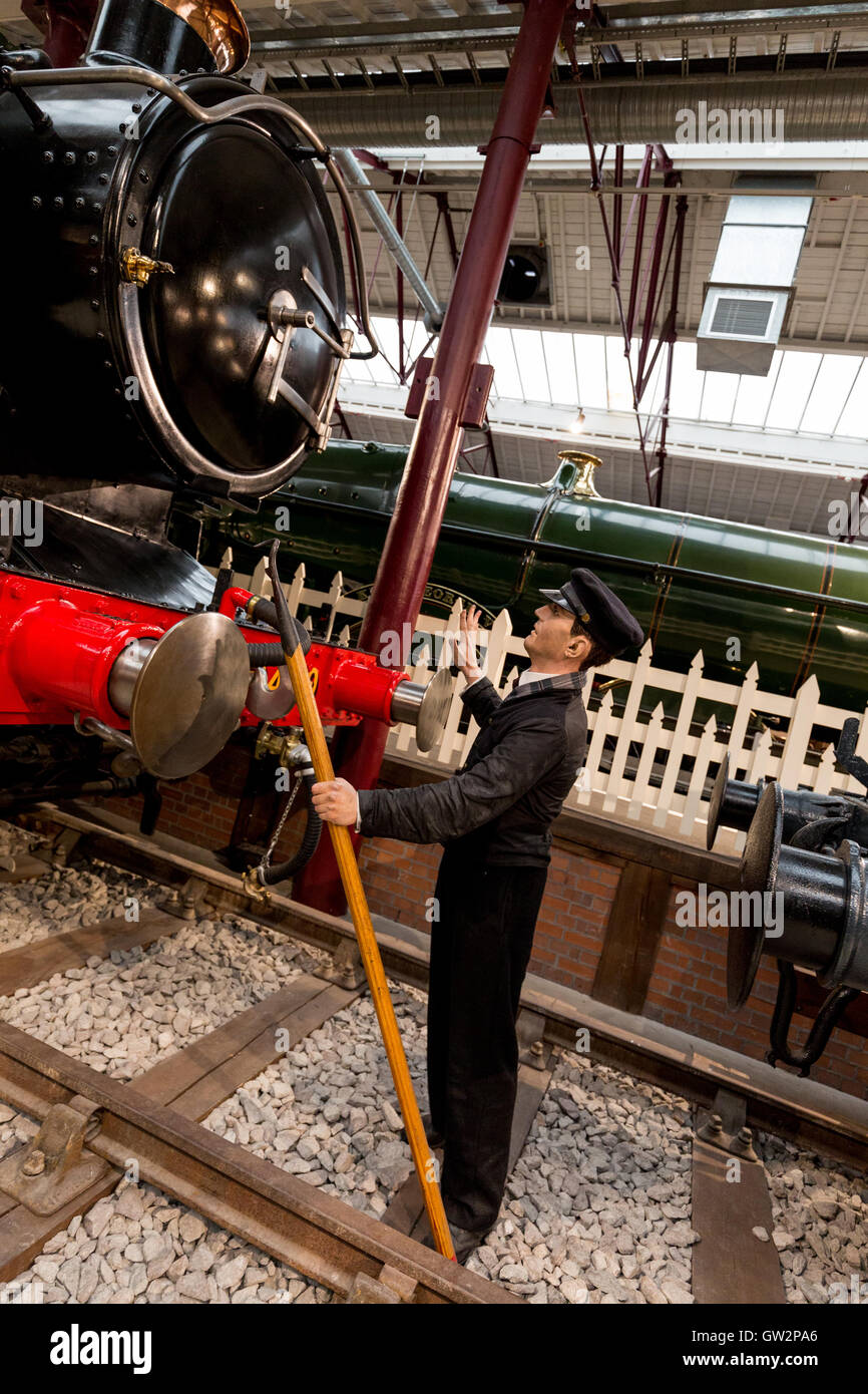 Shunter coupling up trucks on the GWR in bygone times. Swindon Railway museum England UK Stock Photo