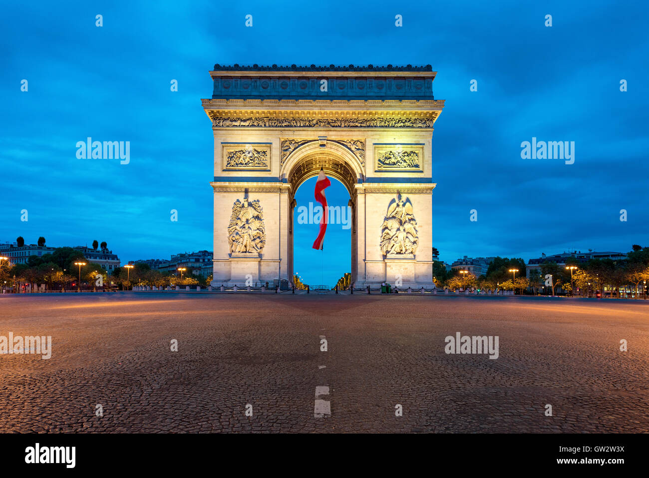 Arc de Triumph Paris and Champs Elysees with a large France flag flying under the arch in Europe victory day at Paris, France. Stock Photo