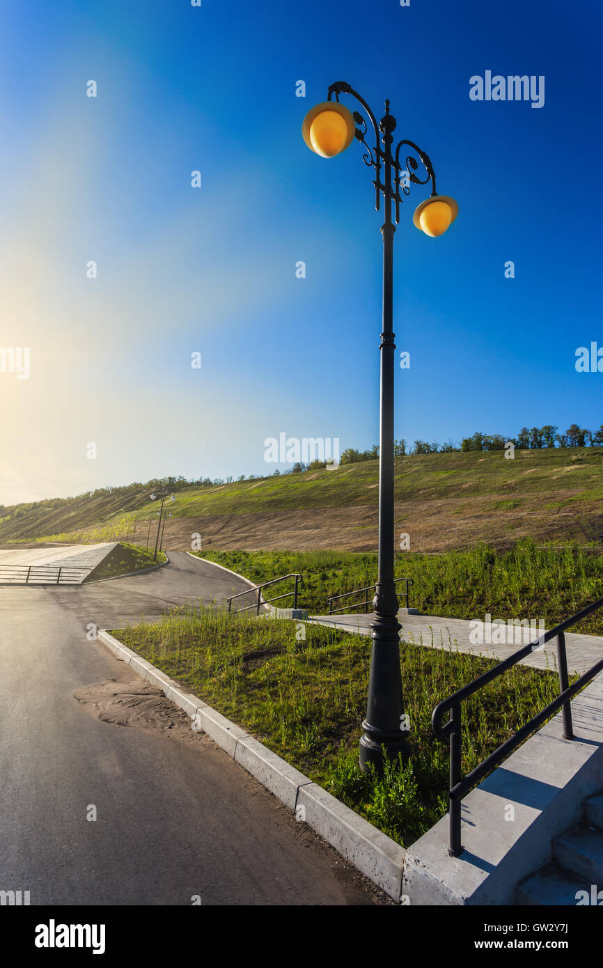 Street lights on the promenade of great river Stock Photo