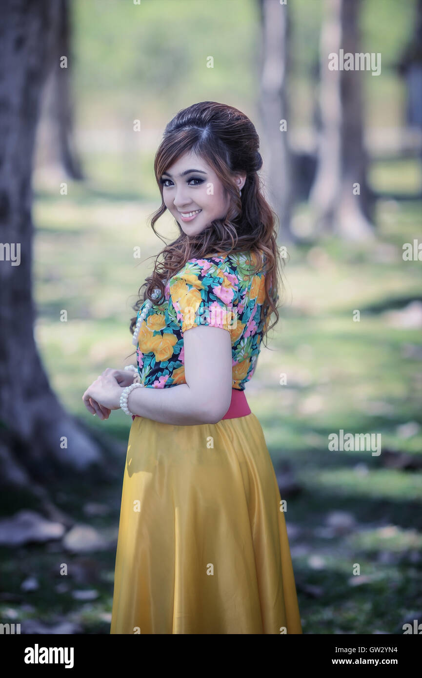 asia beautiful girl in the yellow dress on nature Stock Photo - Alamy