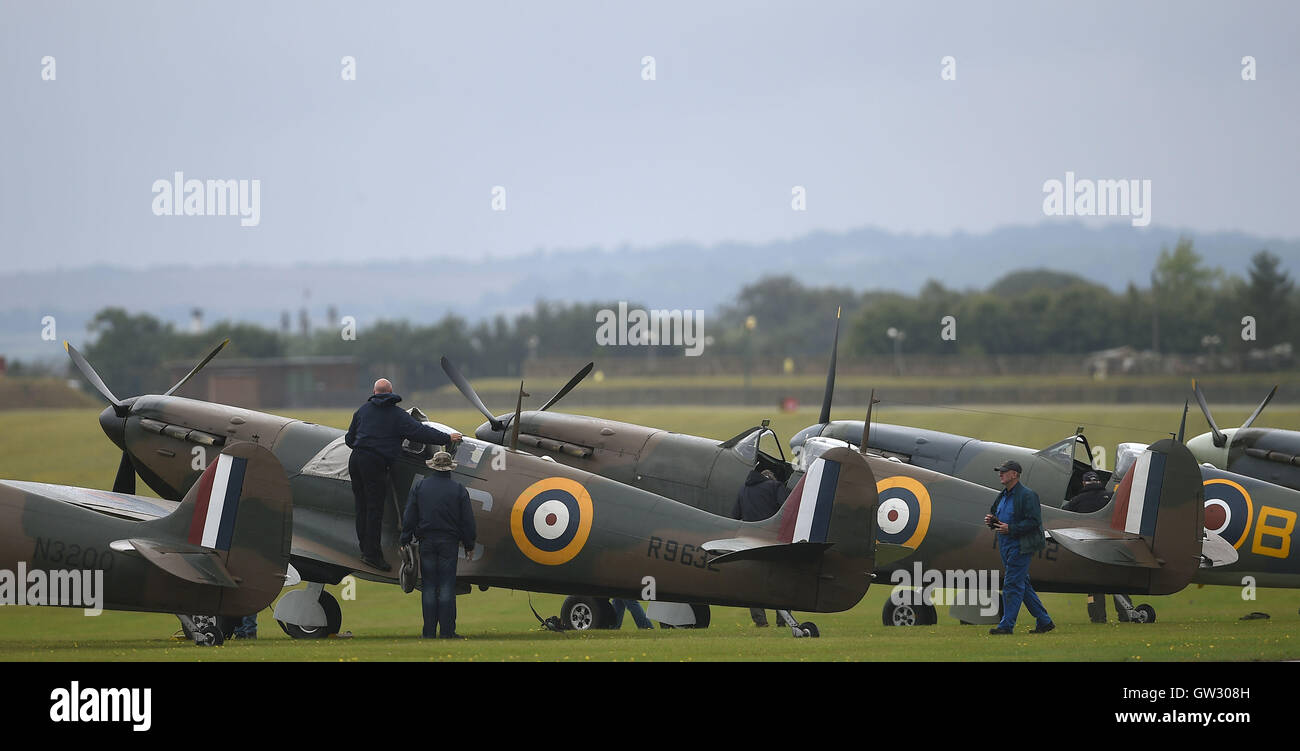 Supermarine Spitfire Mk1a aircraft are prepared for flight during The Duxford Air Show 2016 at The Imperial War Museum in Duxford, Cambridgeshire. Stock Photo