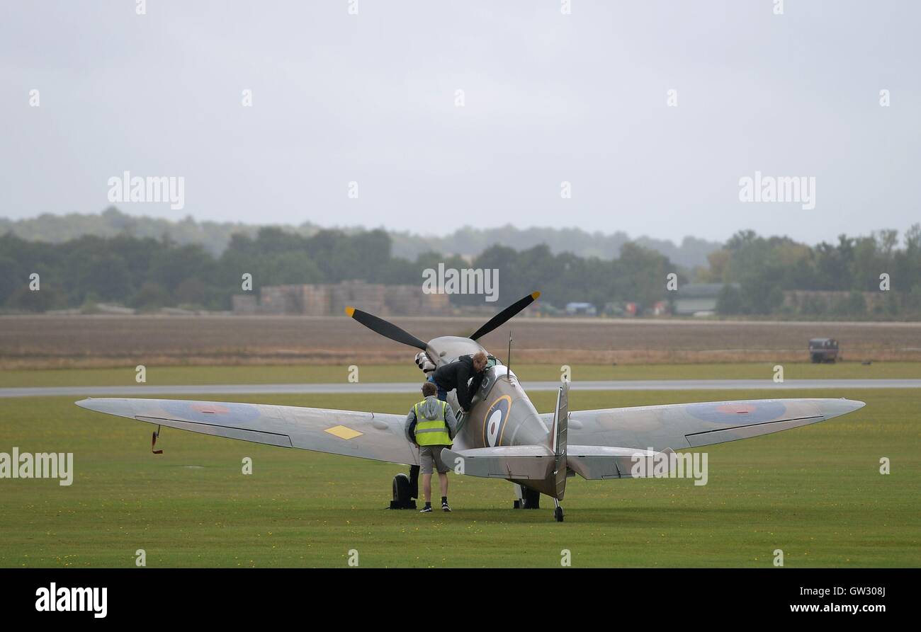 A Supermarine Spitfire Mk1a is prepared for flight during The Duxford Air Show 2016 at The Imperial War Museum in Duxford, Cambridgeshire. Stock Photo