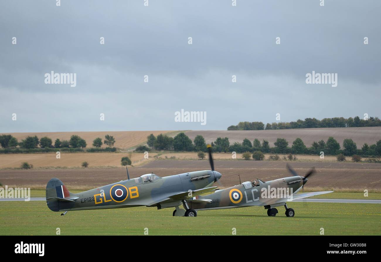 A pair of Supermarine Spitfire Mk1a aircraft prepare to fly during The Duxford Air Show 2016 at The Imperial War Museum in Duxford, Cambridgeshire. Stock Photo