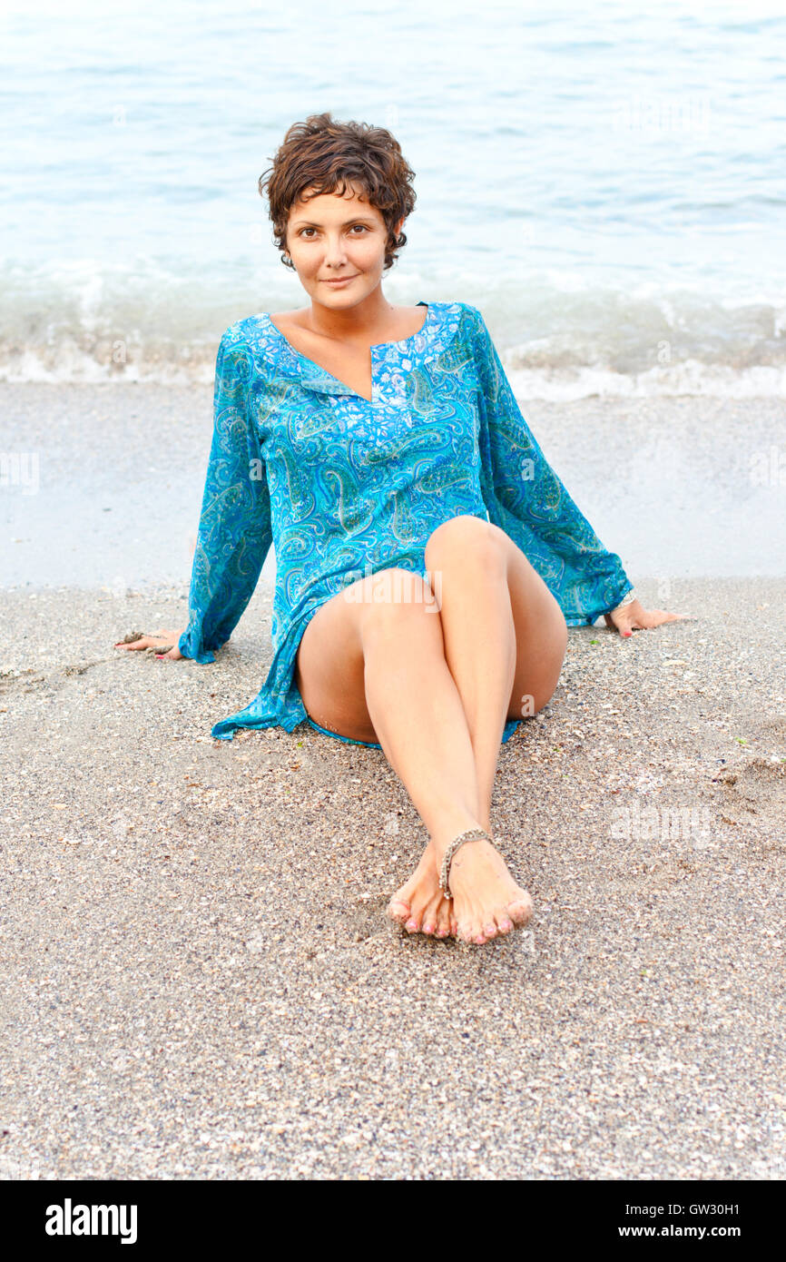 woman in blue dress on the beach Stock Photo - Alamy