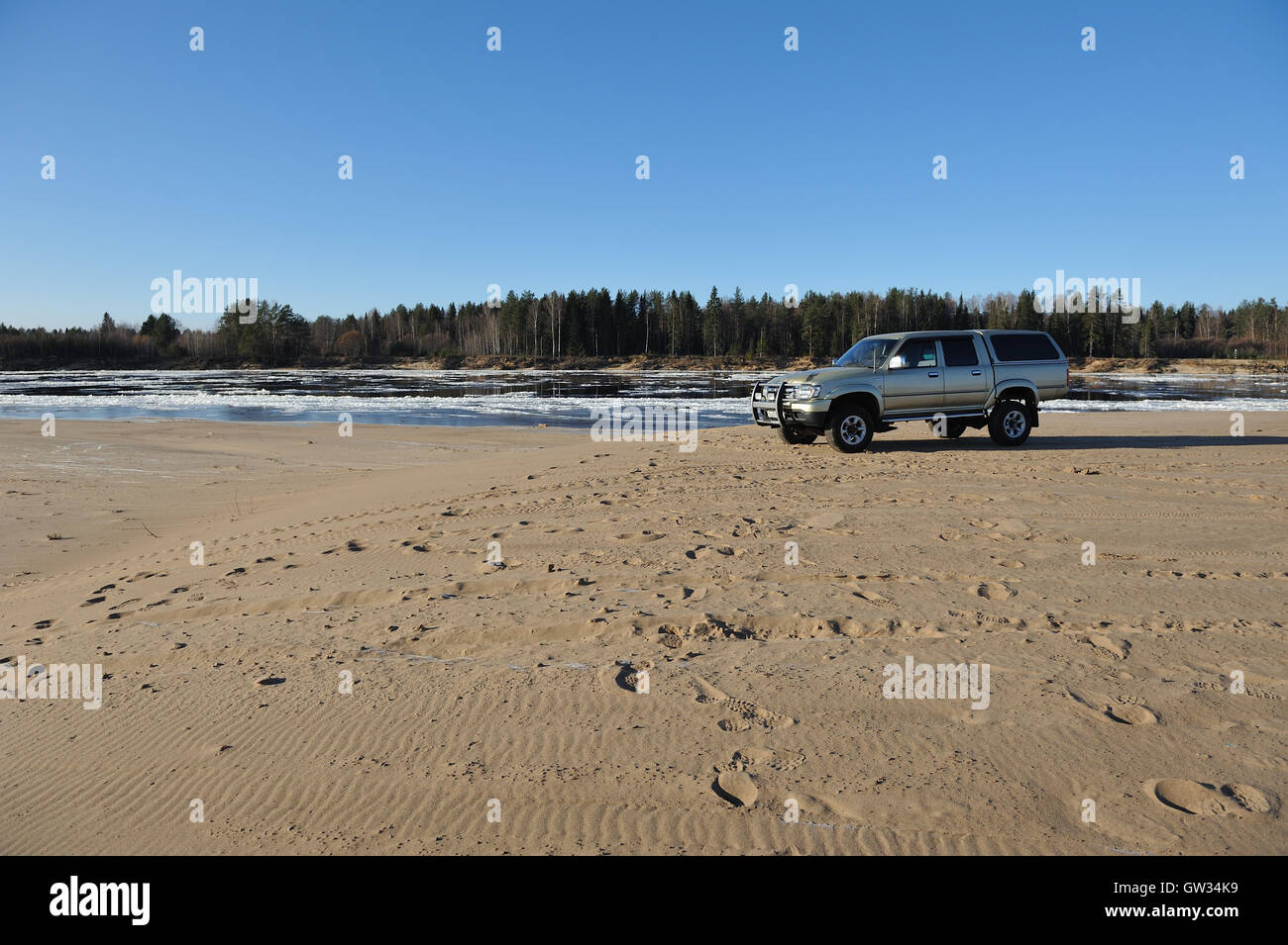 Great wall deer pickup on sandy beach of river. Stock Photo
