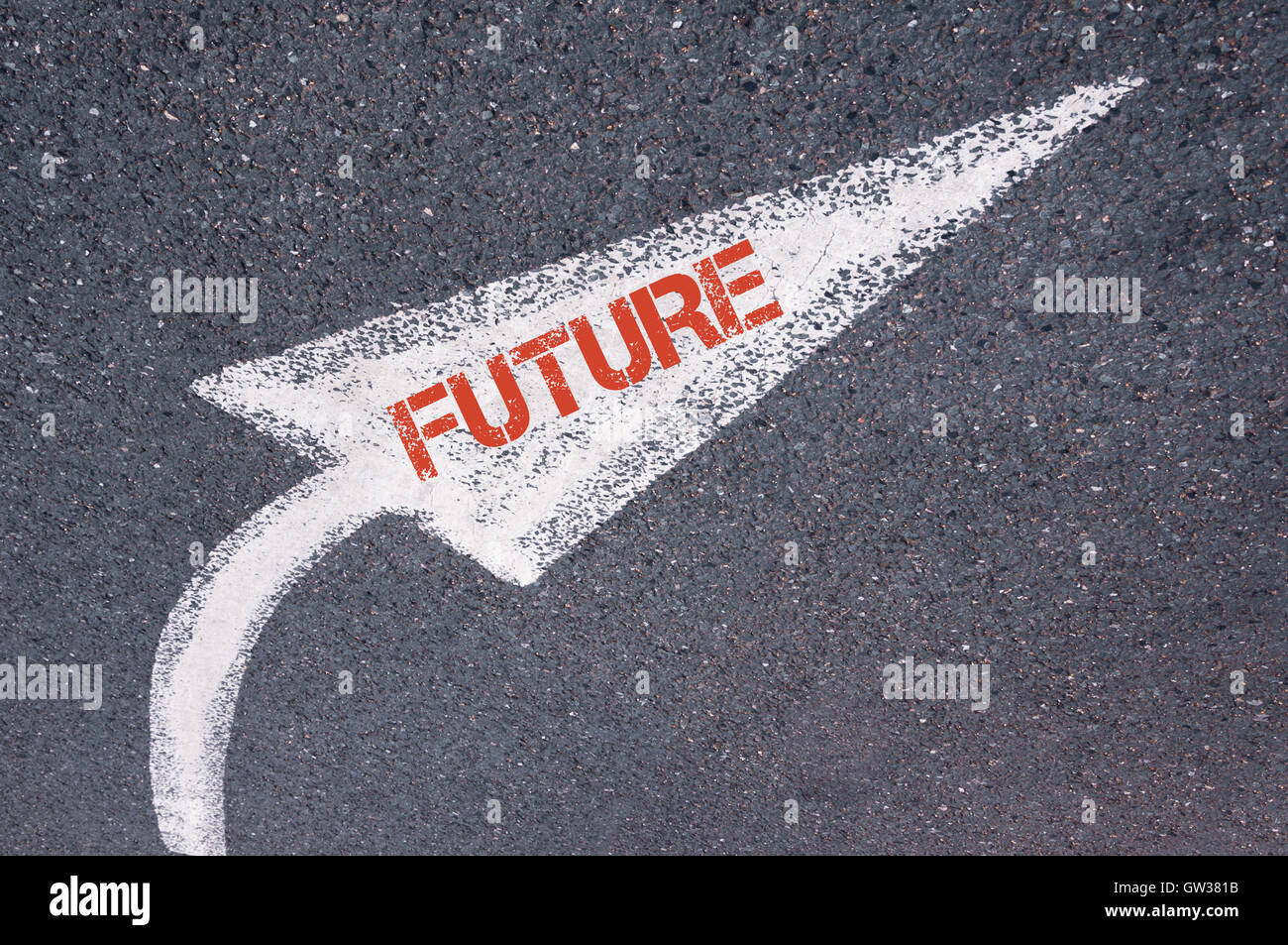 Directional white painted arrow with word FUTURE over road surface ...