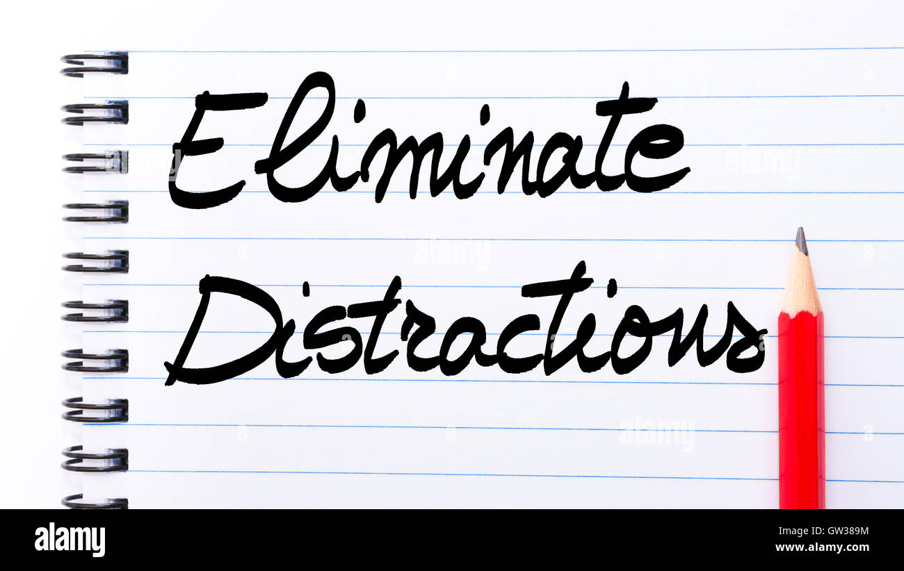 Eliminate Distractions written on notebook page with red pencil on the right as Business Concept Stock Photo