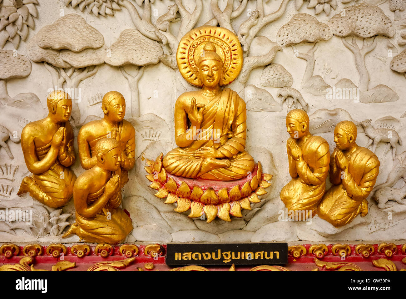 Traditional Thai style art sculpture on temple's wall Stock Photo