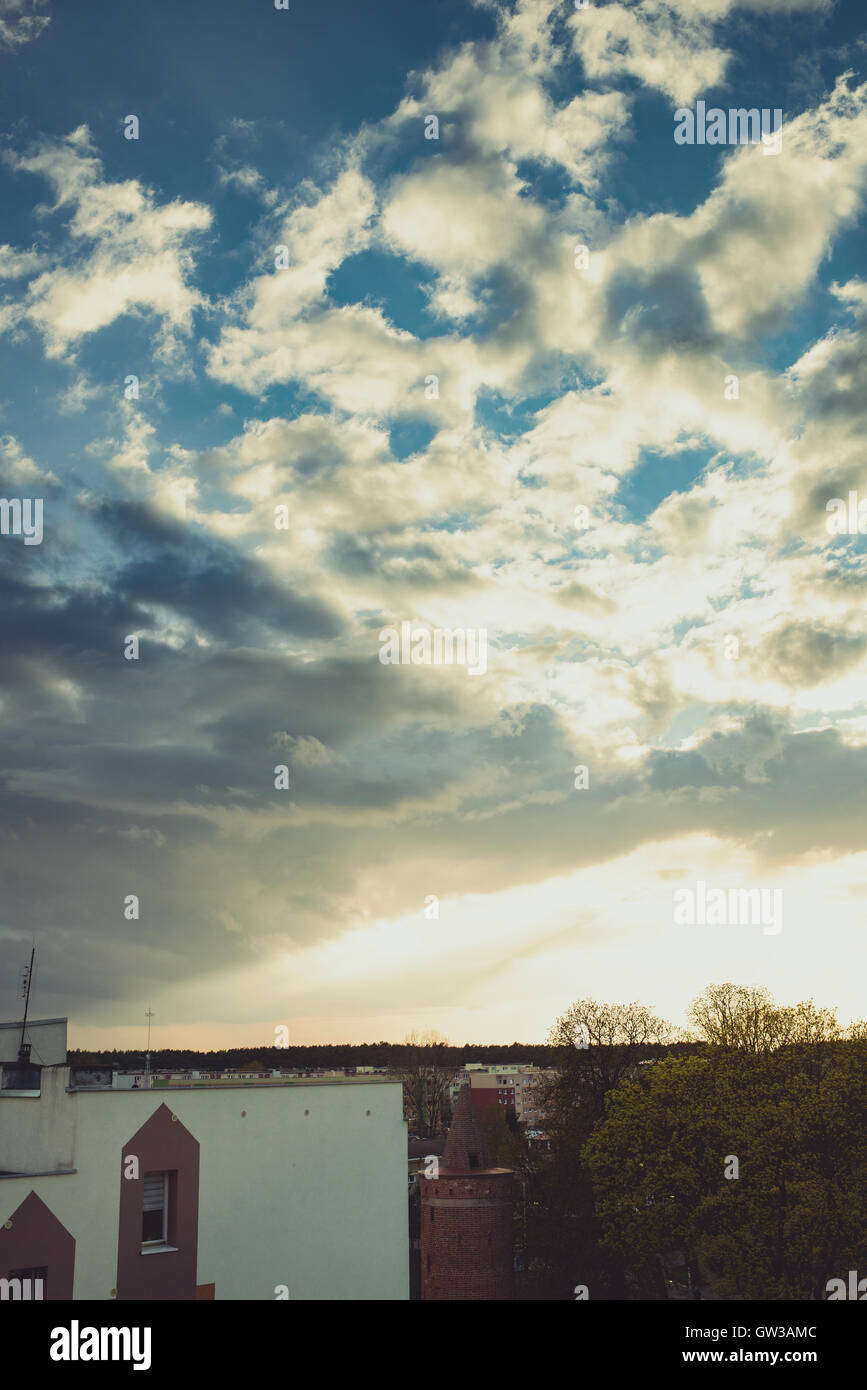 Majestic sunset with clouds over the city Stock Photo - Alamy