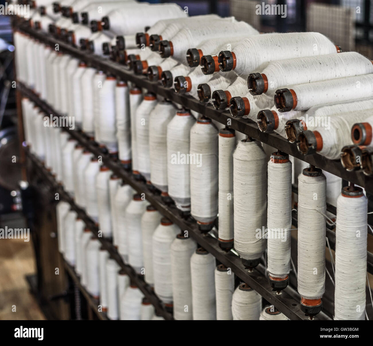 Industrial cotton reel bobbins. Stock Photo