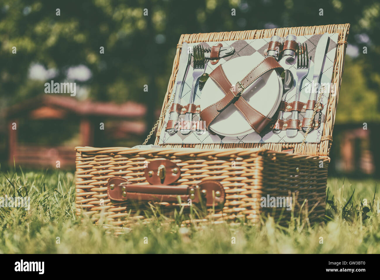 Opened Picnic Basket With Cutlery In Spring Green Grass Stock Photo Alamy