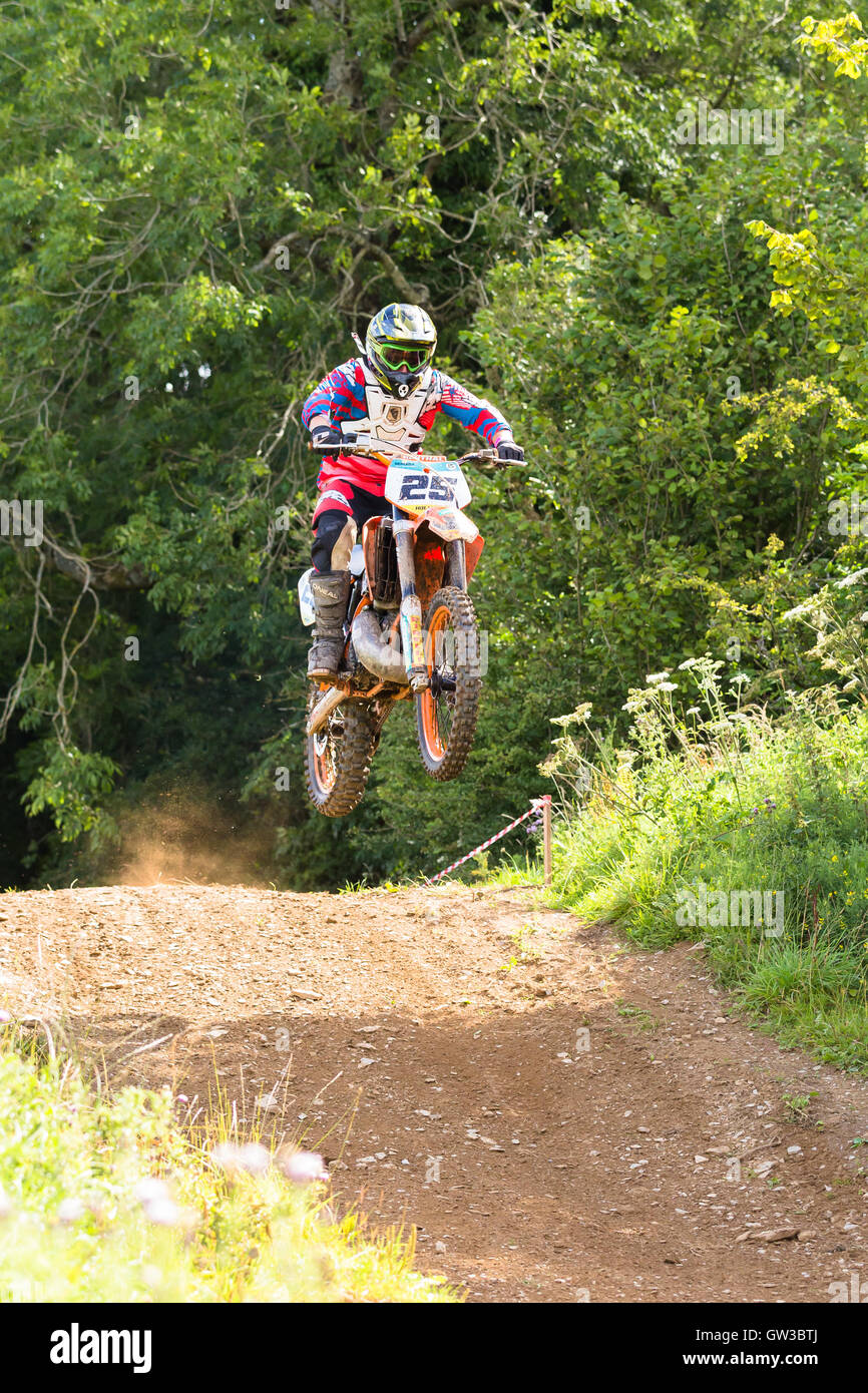 enduro rider performing a jump Stock Photo - Alamy