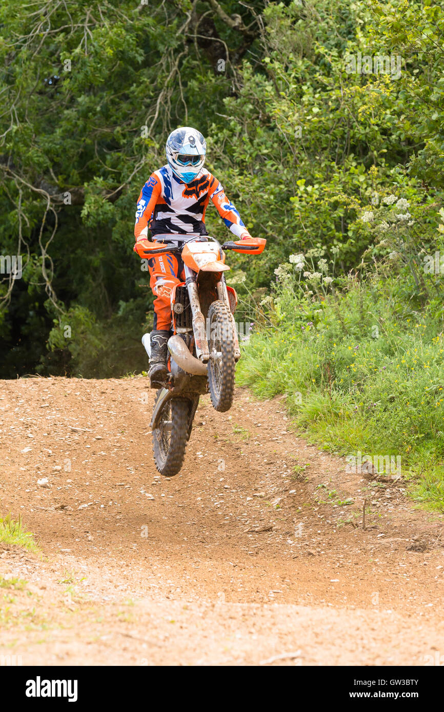 enduro rider performing a jump Stock Photo - Alamy