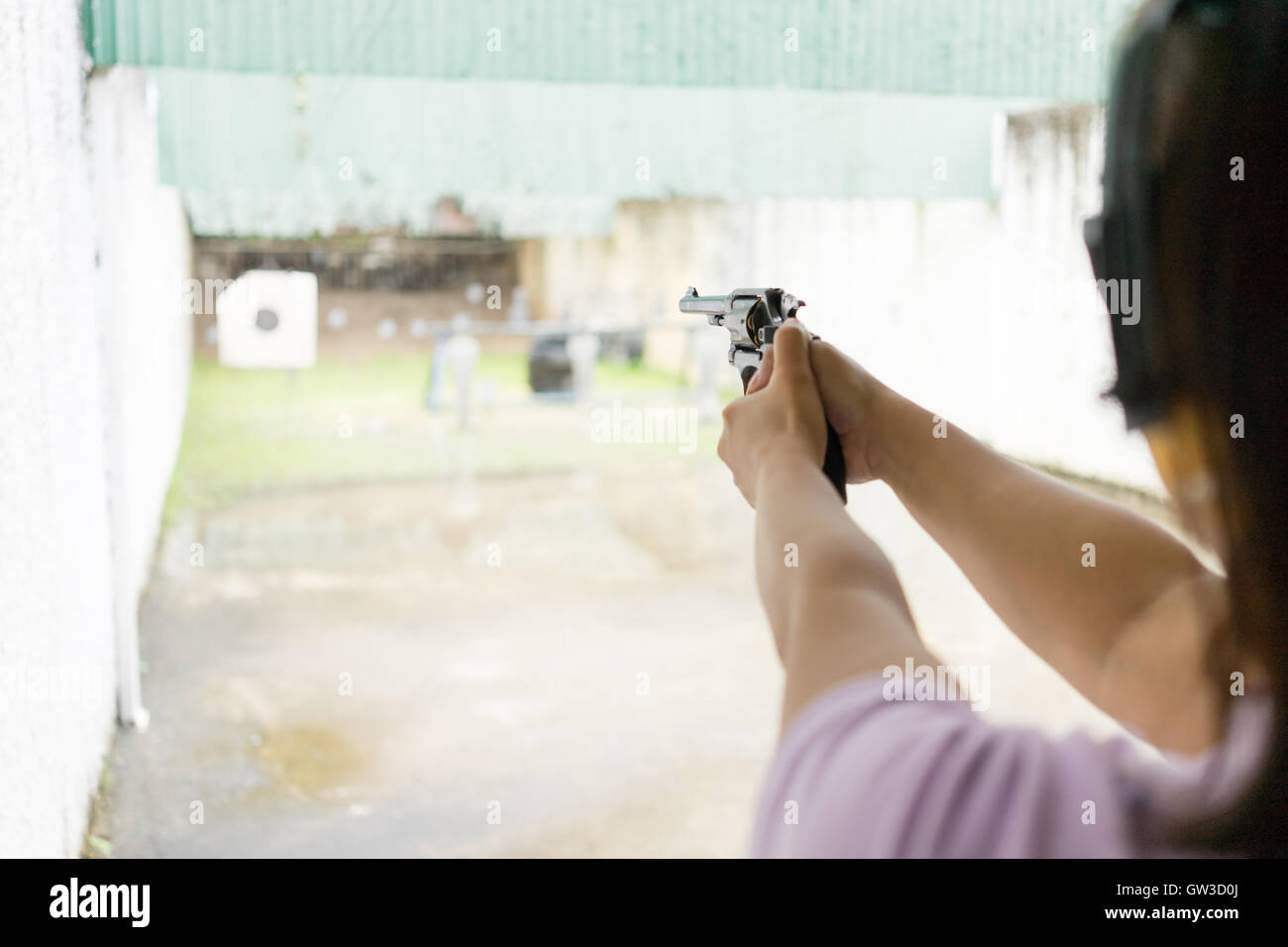 Woman in shooting range hi-res stock photography and images - Alamy