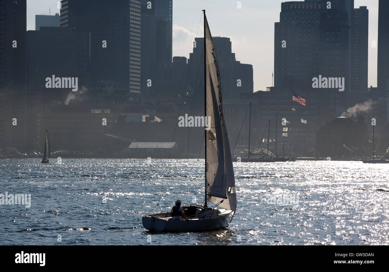 Sail boat Boston Harbor and city skyline, Boston Massachusetts Stock