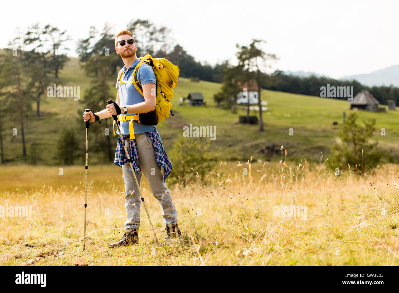 Young backpacking man rest at the hill Stock Photo