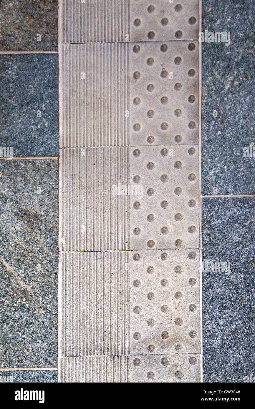 Closeup detail of the tactile paving from Milan, Italy Stock Photo
