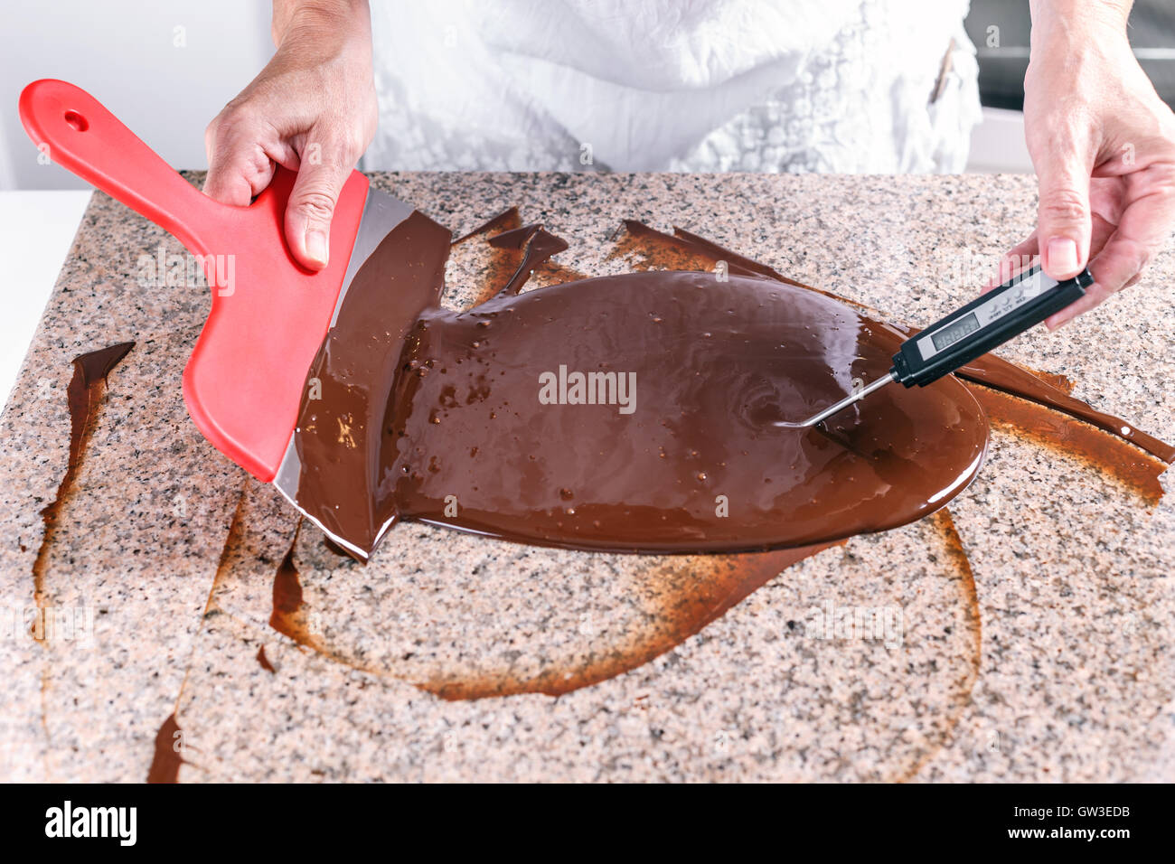 Measuring temperature of melted chocolate Stock Photo - Alamy