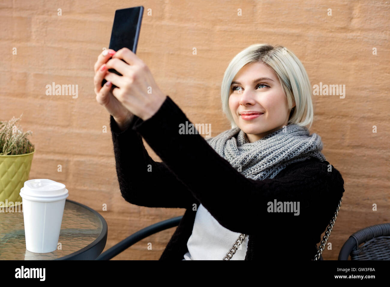 Happy Young Woman Taking Selfie At Sidewalk Cafe Stock Photo - Alamy