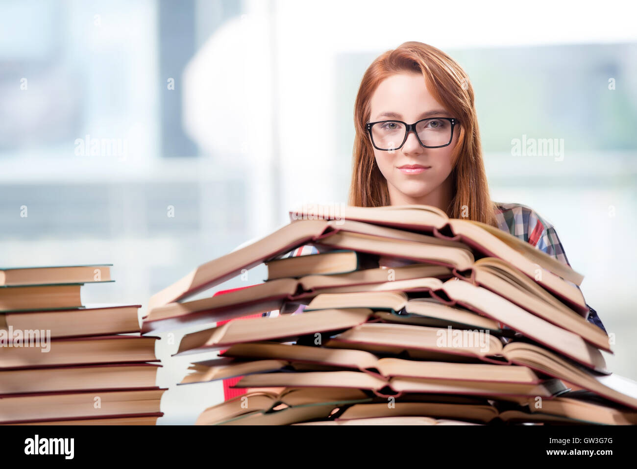 Using Books Student stacks books preparing hi-res stock photography and images - Alamy