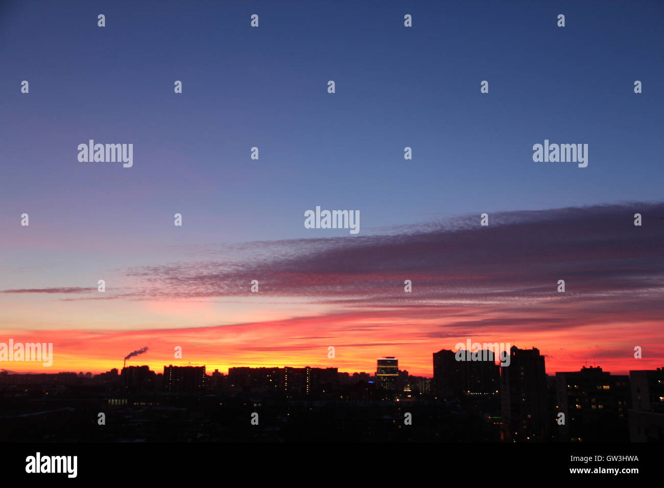 Beautiful dramatic sunrise with red sky the city Stock Photo - Alamy