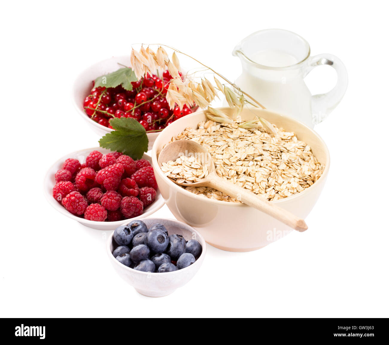 Bowls of oat flakes cereal and various berries Stock Photo Alamy