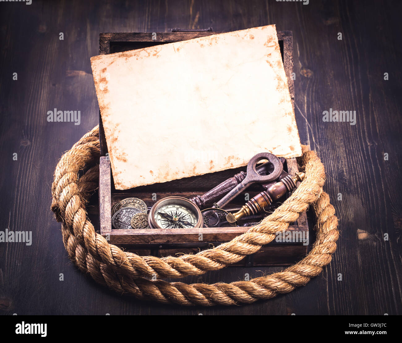 Old card and marine accessories in wooden box Stock Photo