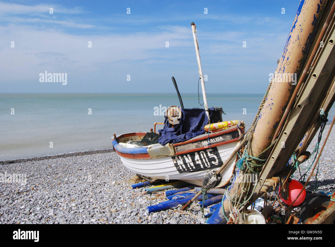 Old fishing boat sitting on a pebble beach hi-res stock photography and ...