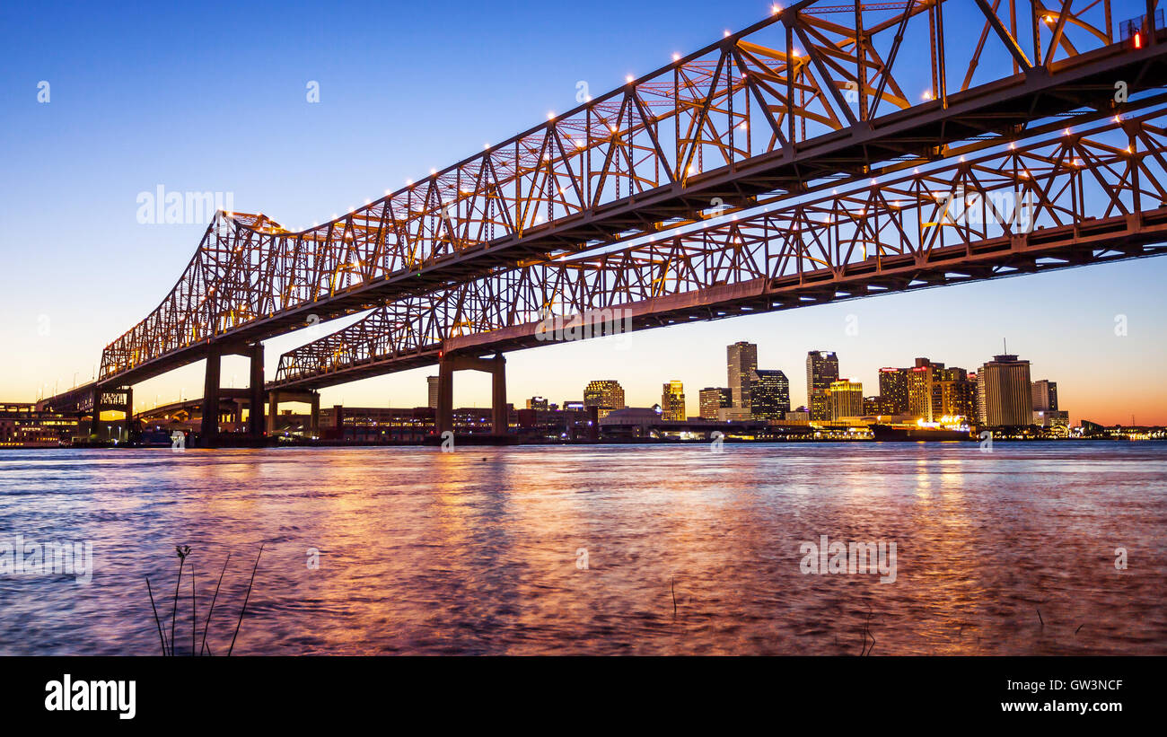 Crescent City Connection Bridge carries traffic over the Mississippi River into New Orleans at night Stock Photo