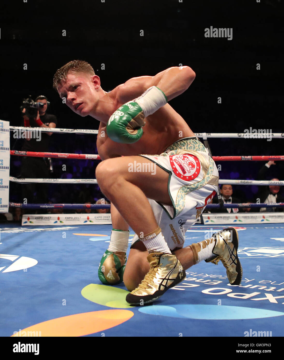 Charlie Edwards reacts after being knocked down by Johnriel Casimero during their IBF Flyweight World Championship bout at The O2 Arena, London. Stock Photo