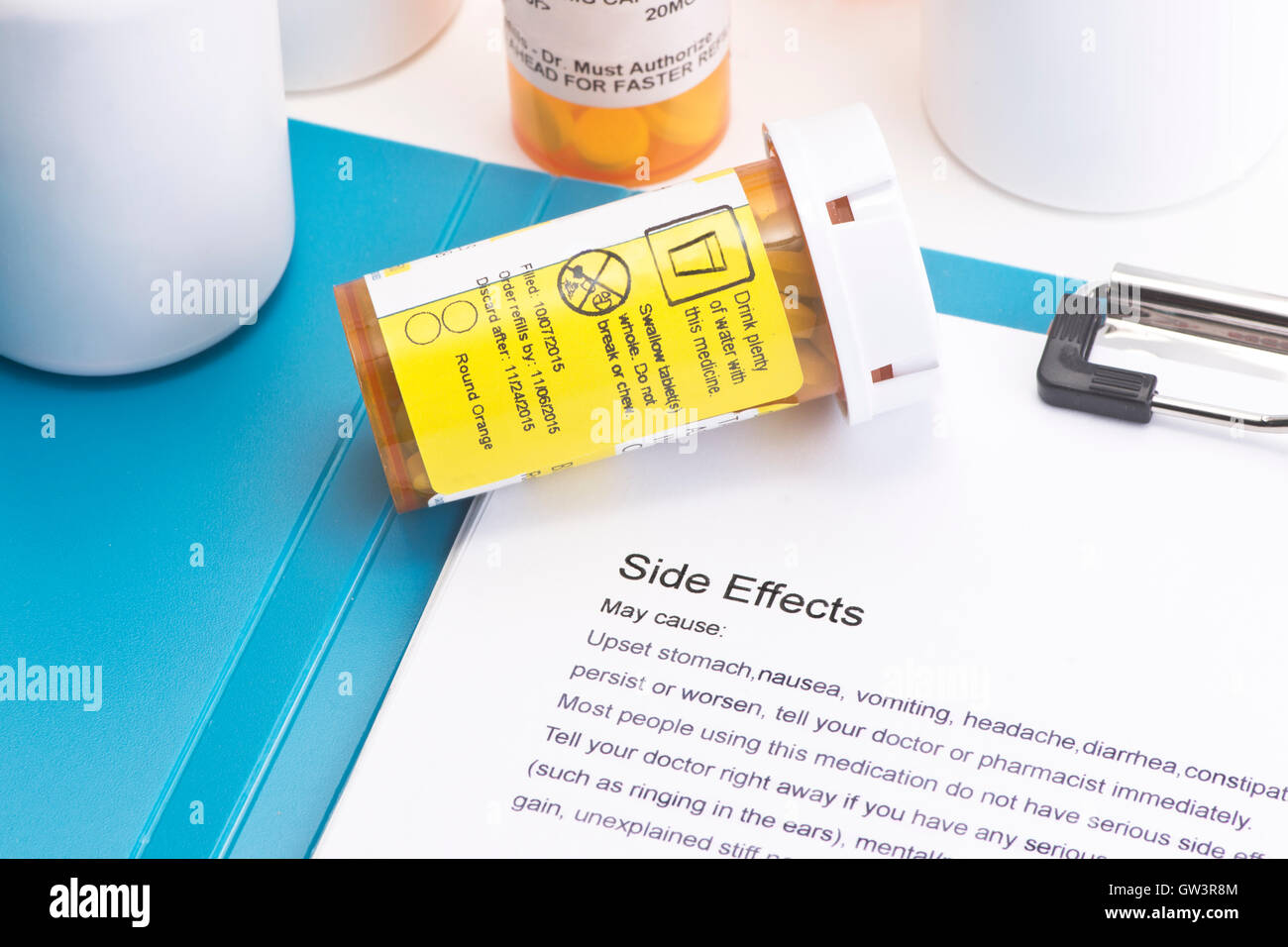 Prescription bottle with directions for use.  Labels and document are created by photographer. Stock Photo