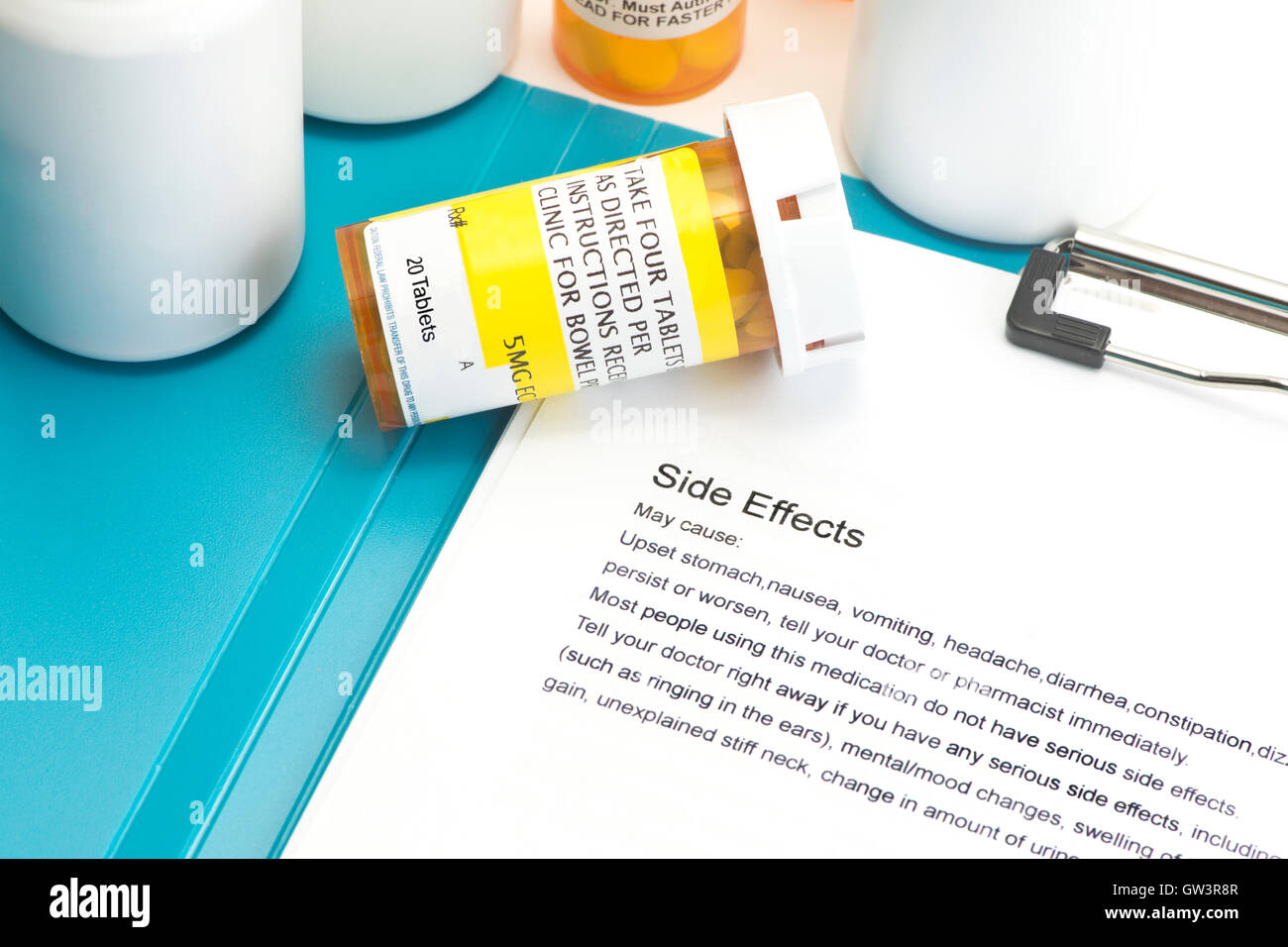 Prescription bottle with directions for use.  Labels and document are created by photographer. Stock Photo
