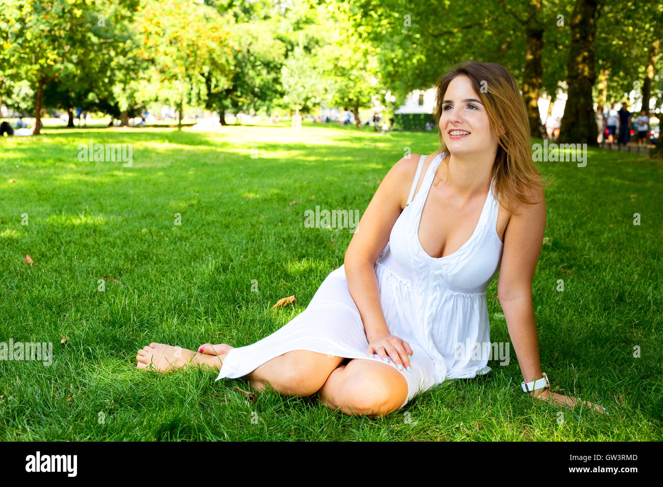 young woman sitting in the park Stock Photo