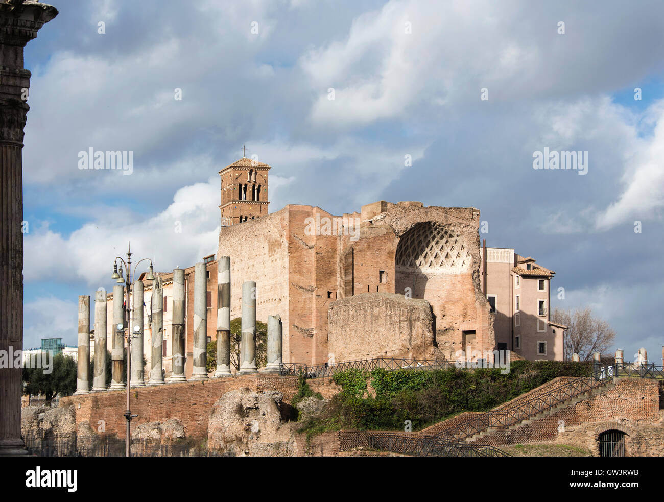 Temple of Venus and Roma ancient ruins with apse and columns at the entrance of Roman Forum Stock Photo