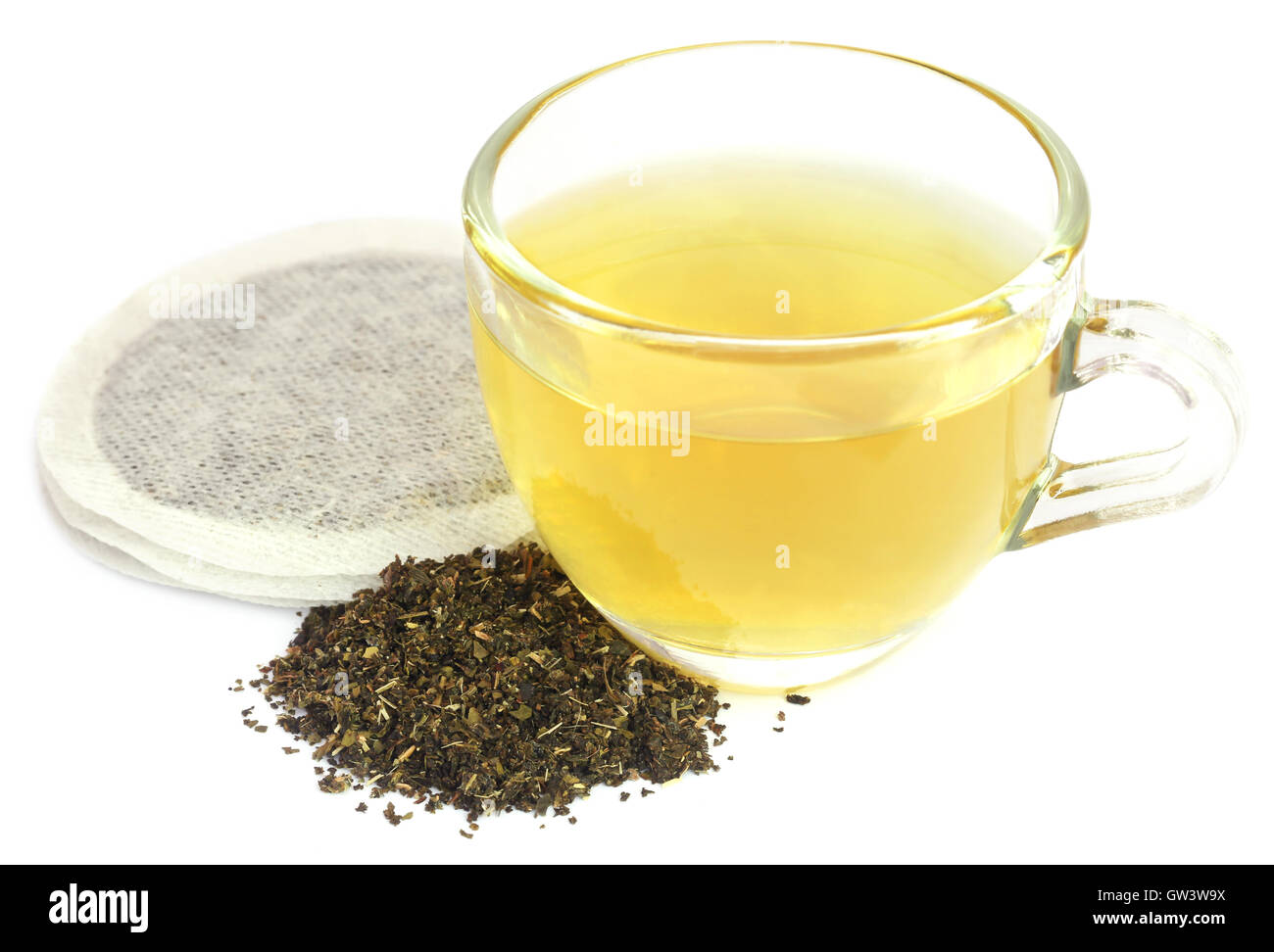 Green tea with teabag over white background Stock Photo