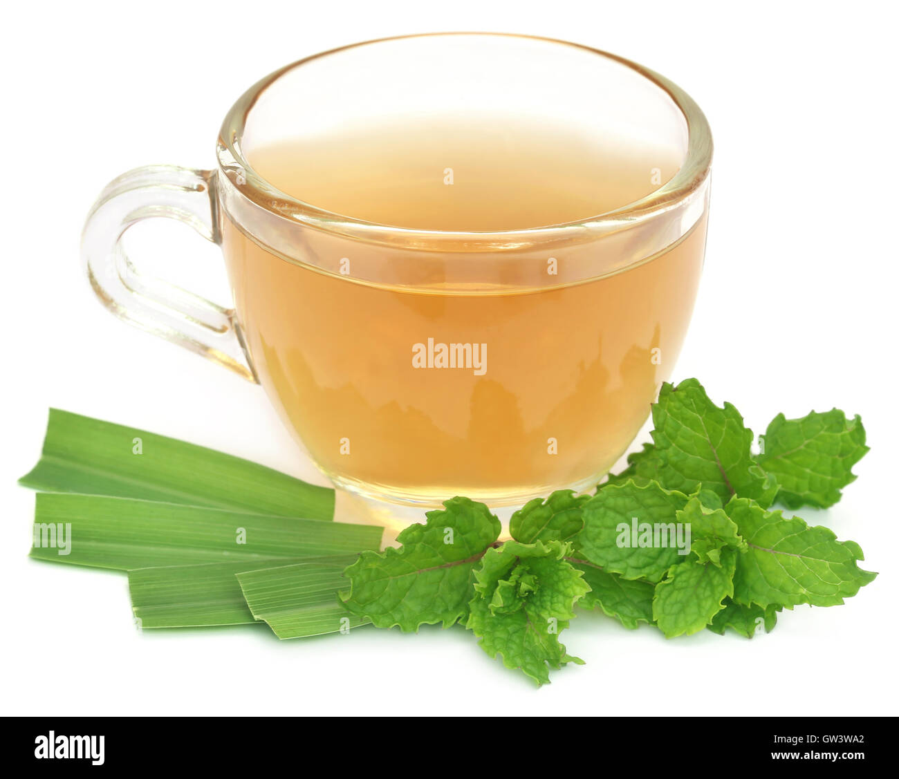 Herbal tea in a cup with herbs over white background Stock Photo Alamy