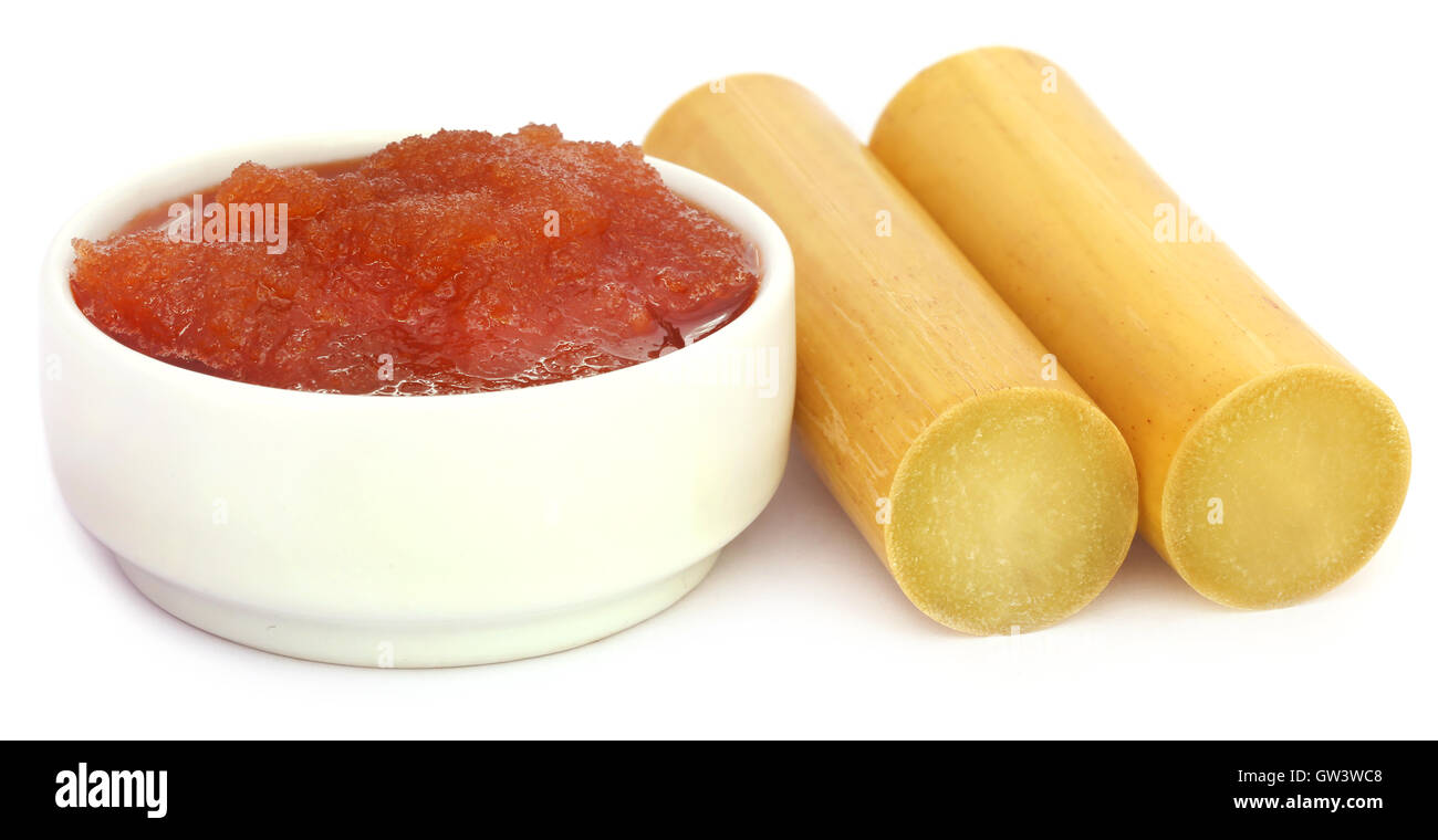 Molasses with sugarcane over white background Stock Photo Alamy