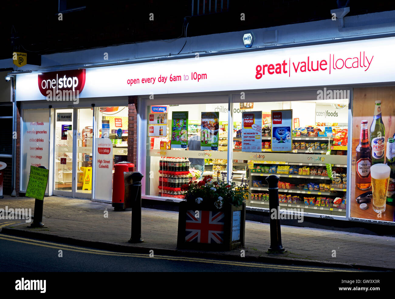 One Stop grocery shop at night, England UK Stock Photo